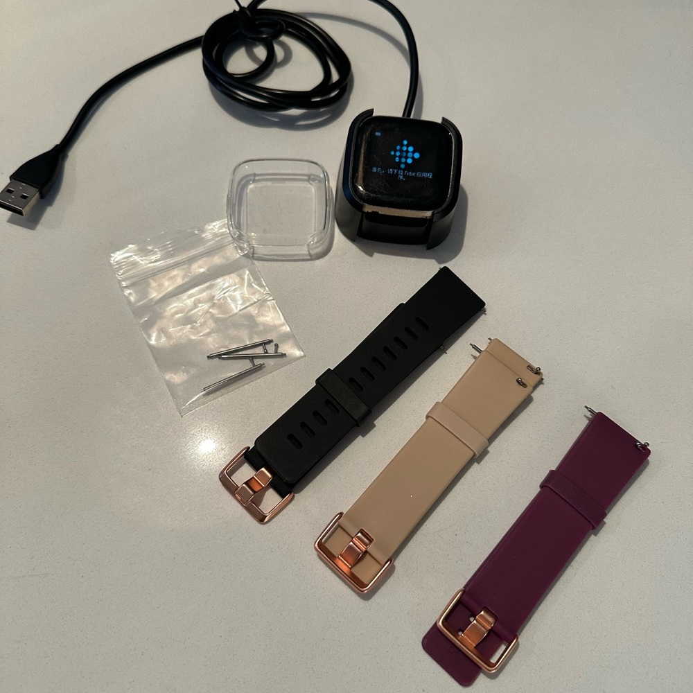 Fit bit versa 2 watch, bands, charger, screen protector.